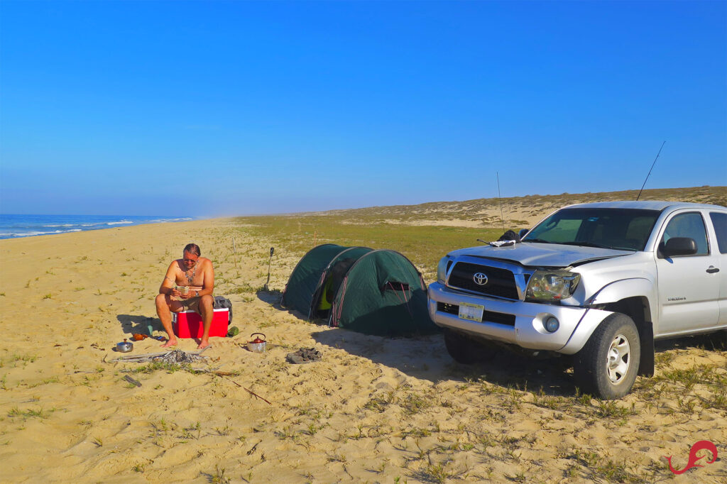 Our injured truck on the beach, resting while we're fishing in the Pacific